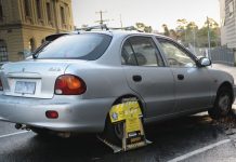 Sheriff-clamped car a CBD stall-wart clamped