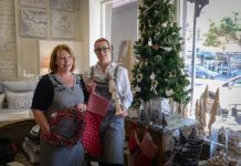 Christmas spirit spreads in windows of shops