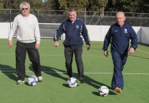 Walking soccer players kick their heels up