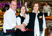 Edith cuts the ribbon