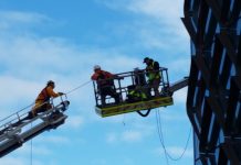Three rescued after crane tips